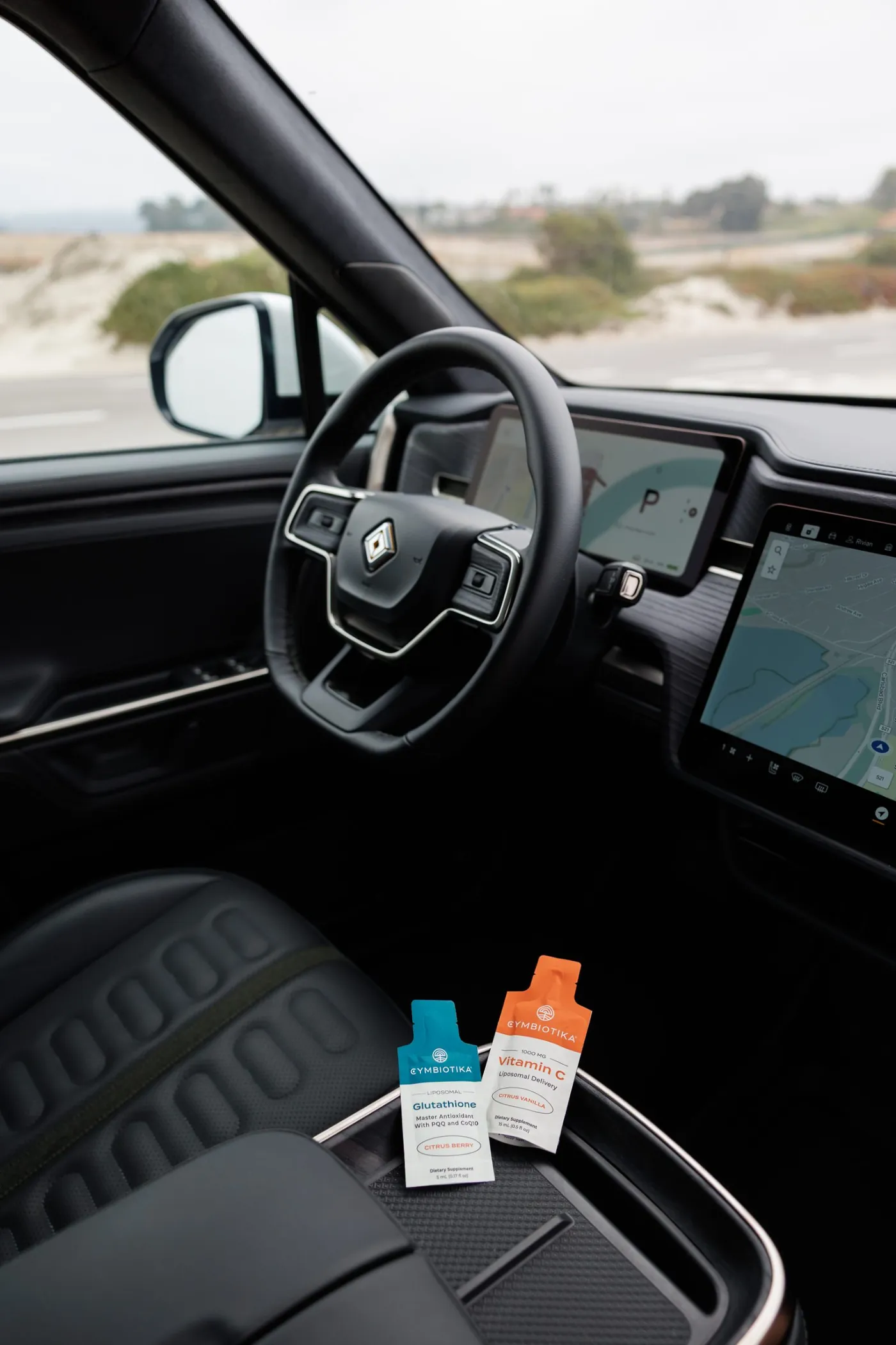 Glutathione and Vitamin C packets in the Rivian console